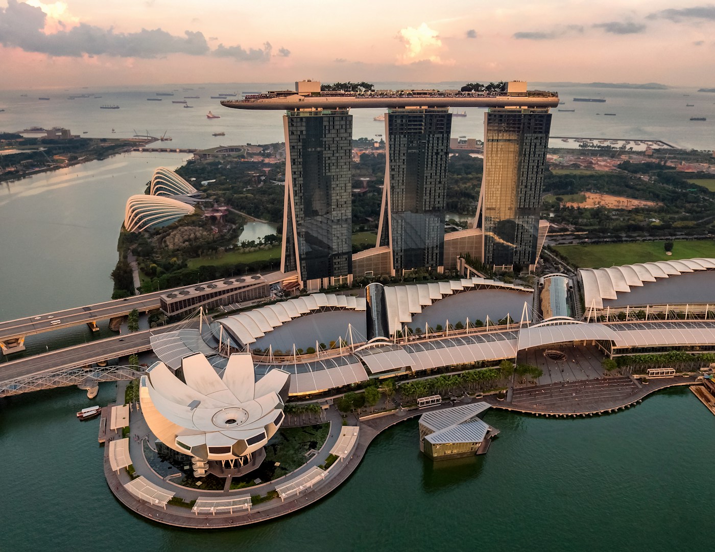 Marina Bay Sands and the Singapore waterfront seen from above at sunset